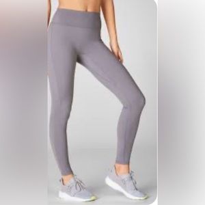 Fabletics gray leggings with sheer cut outs.